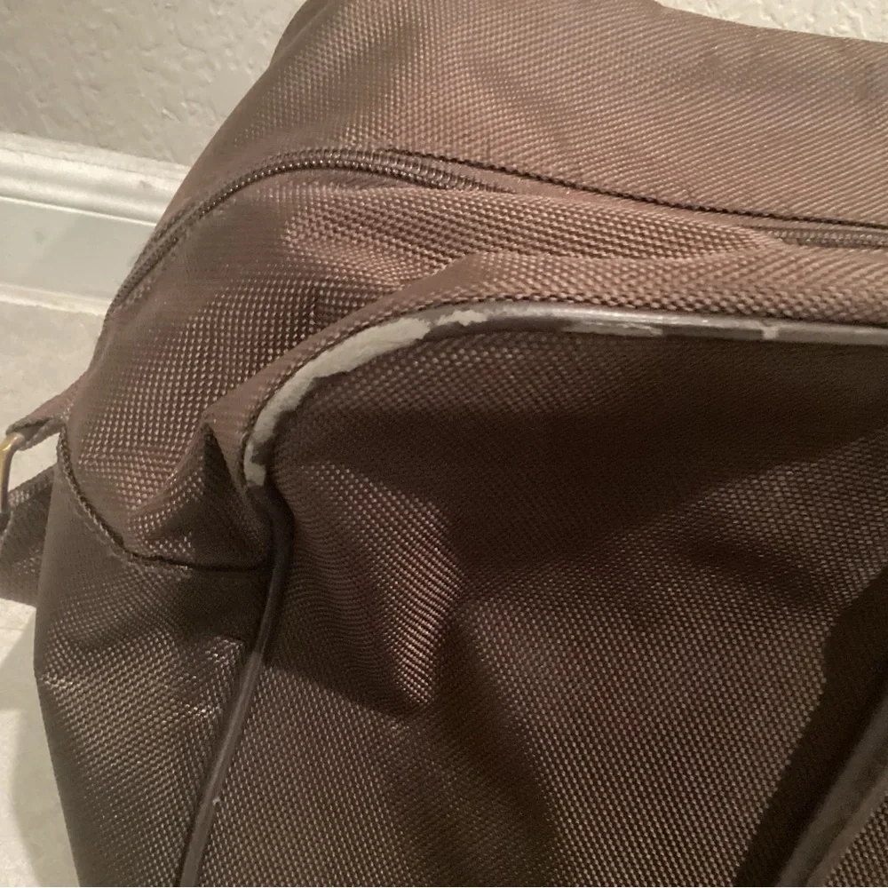 Paco Rabanne Brown Duffel Bag with Structured Design and Top Handles